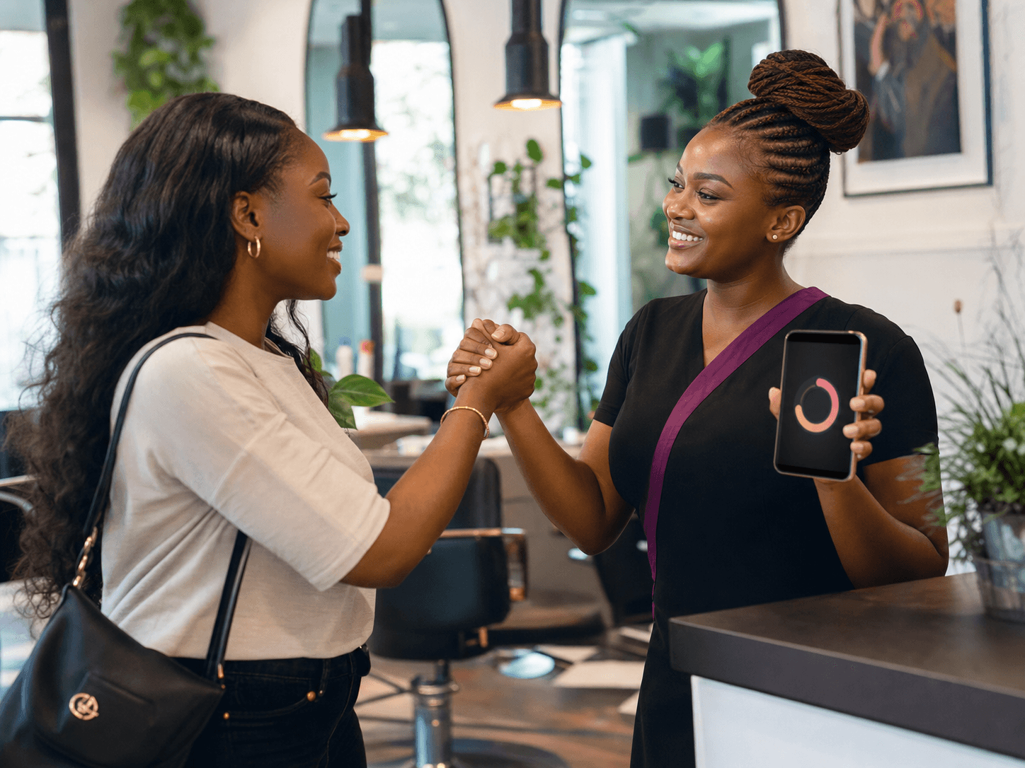 A returning client being welcomed by a beauty professional